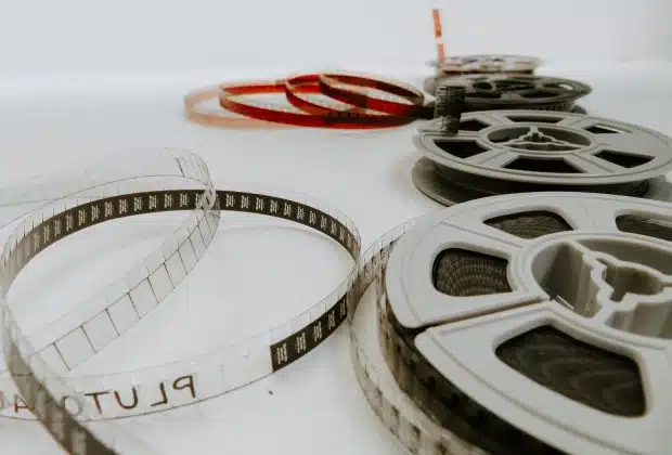 four reel films lying on white table